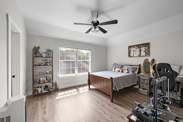 bedroom featuring ceiling fan and light wood-type flooring