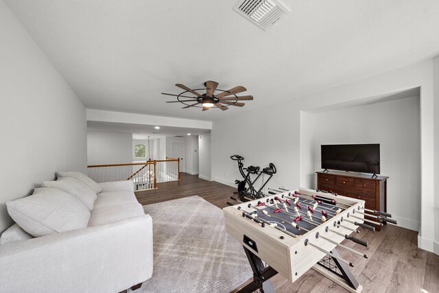 playroom featuring ceiling fan and hardwood / wood-style flooring