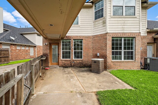 exterior space featuring cooling unit and a patio