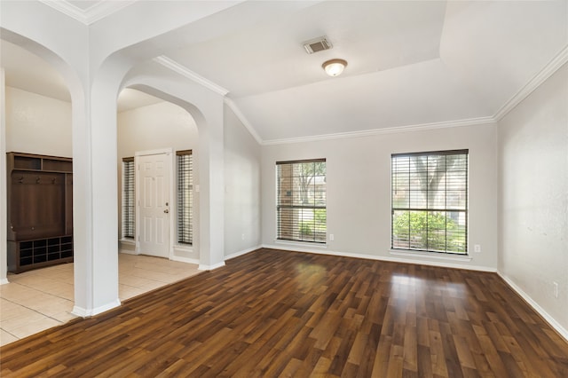 spare room featuring crown molding and hardwood / wood-style flooring