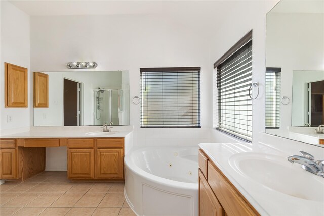 bathroom featuring tile patterned floors, shower with separate bathtub, and vanity