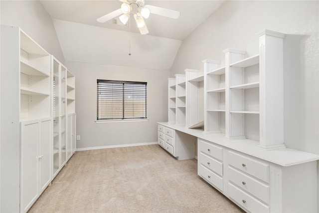 spacious closet with lofted ceiling, ceiling fan, and light carpet