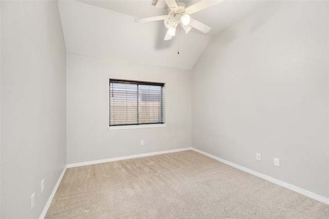 unfurnished room with ceiling fan, carpet floors, and vaulted ceiling