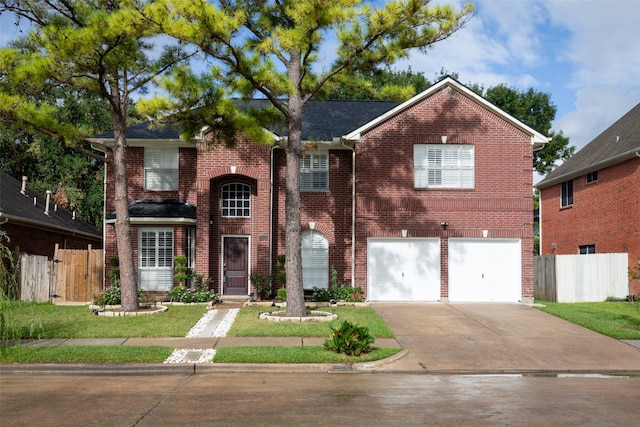 view of front of home with a garage and a front yard