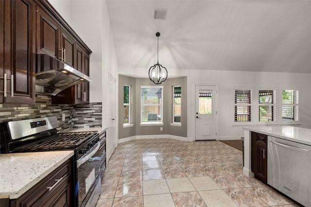 kitchen featuring stainless steel appliances, a chandelier, and dark brown cabinetry