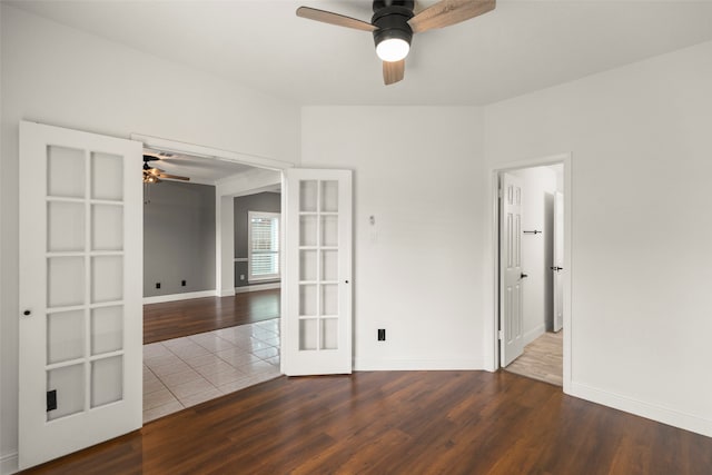 spare room with french doors, hardwood / wood-style flooring, and ceiling fan