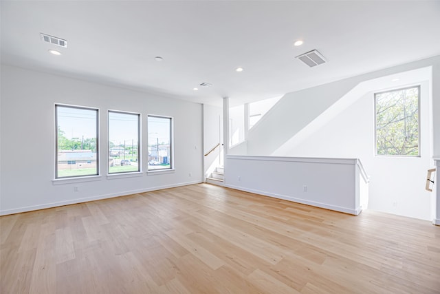 unfurnished living room featuring light hardwood / wood-style flooring