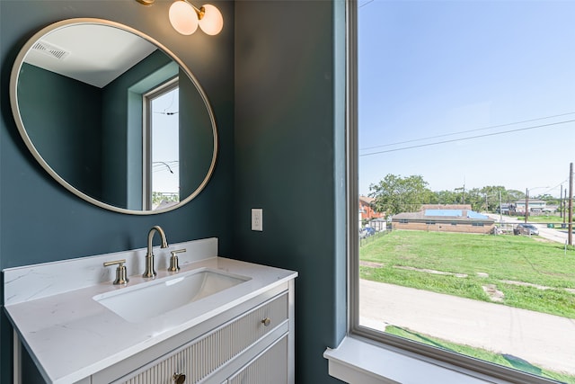 bathroom with vanity and a healthy amount of sunlight