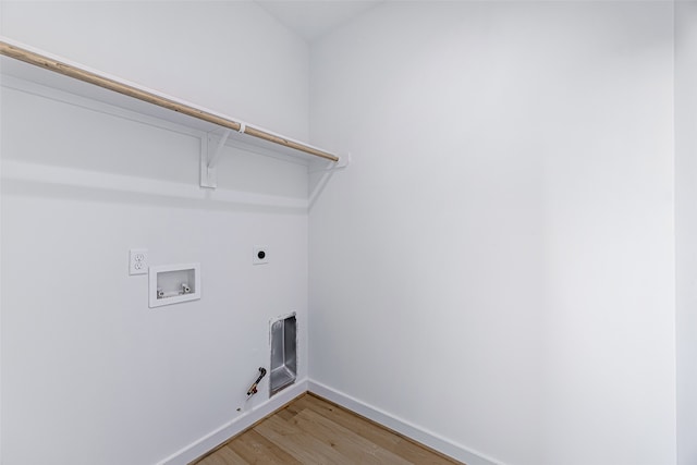 laundry area featuring gas dryer hookup, wood-type flooring, hookup for a washing machine, and electric dryer hookup