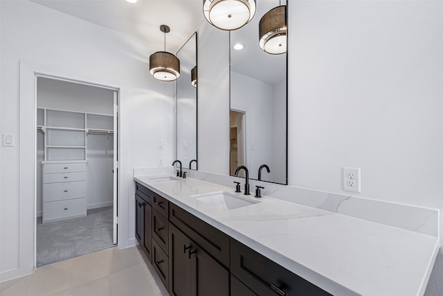 bathroom with tile patterned flooring and vanity