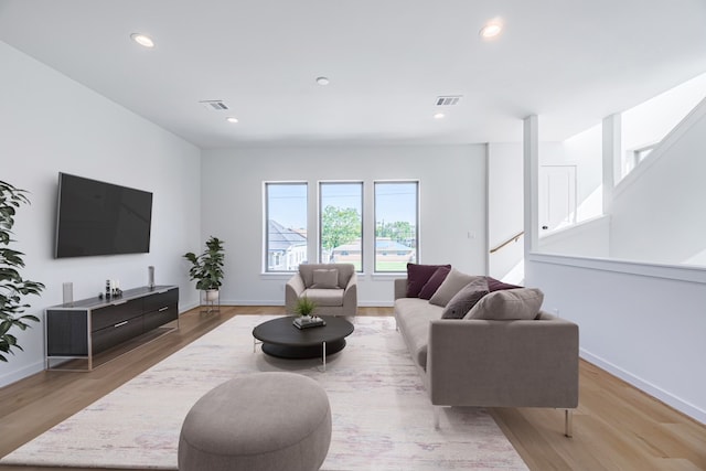 living room with light hardwood / wood-style flooring