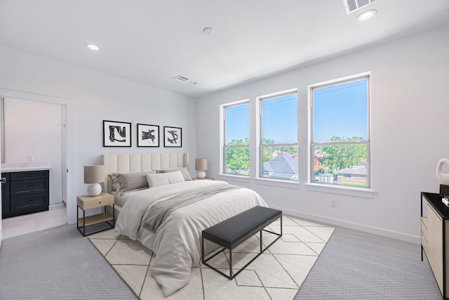 bedroom featuring light carpet