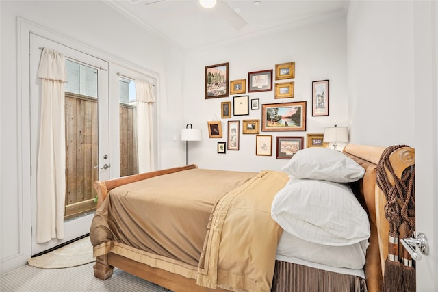 carpeted bedroom with crown molding, ceiling fan, and a baseboard radiator