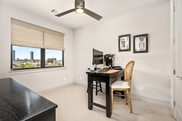 carpeted office with ceiling fan and crown molding