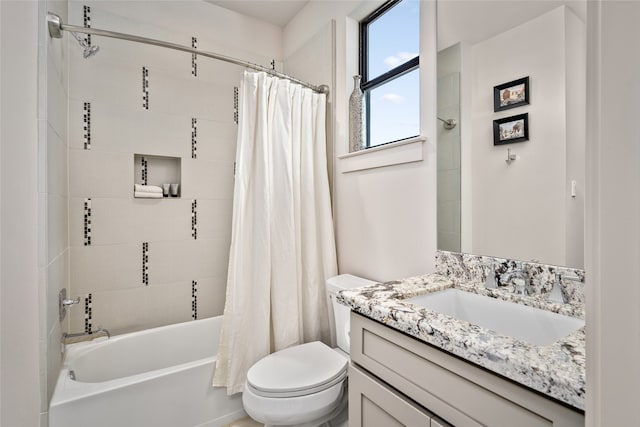 full bathroom with vanity, toilet, and shower / tub combo