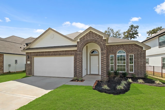 view of front facade featuring a front lawn and a garage