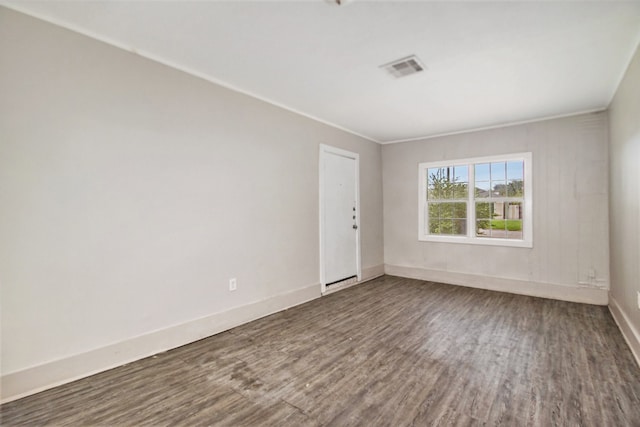 spare room featuring dark hardwood / wood-style floors