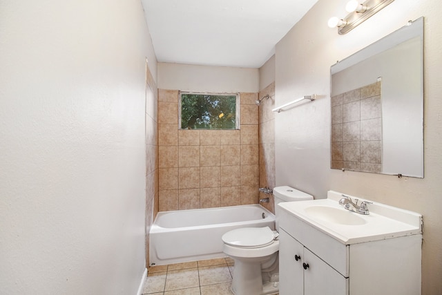 full bathroom featuring tile patterned flooring, vanity, toilet, and tiled shower / bath