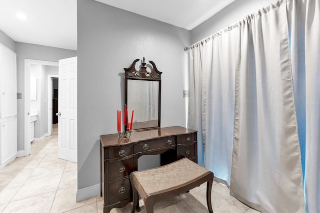 bathroom with tile patterned floors and vanity