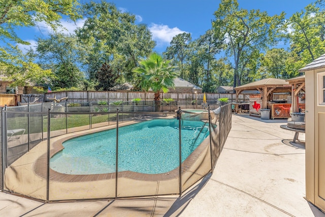 view of swimming pool with a patio and a gazebo