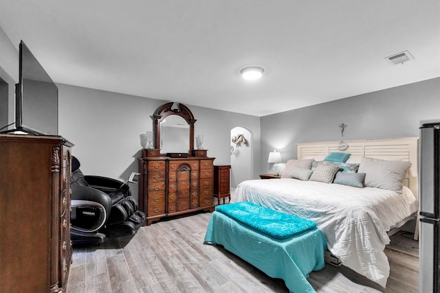 bedroom with light wood-type flooring