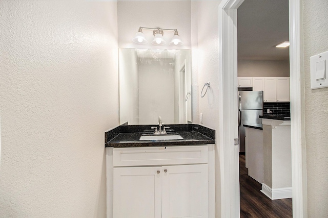 5005 Mallow St A/B, Unit A/B Houston, TX 77033 - bathroom with wood finished floors, a textured wall, and vanity