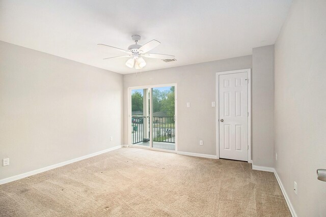 5005 Mallow St A/B, Unit A/B Houston, TX 77033 - spare room featuring light carpet, ceiling fan, and baseboards