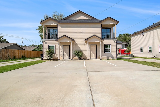 view of front of home with a balcony