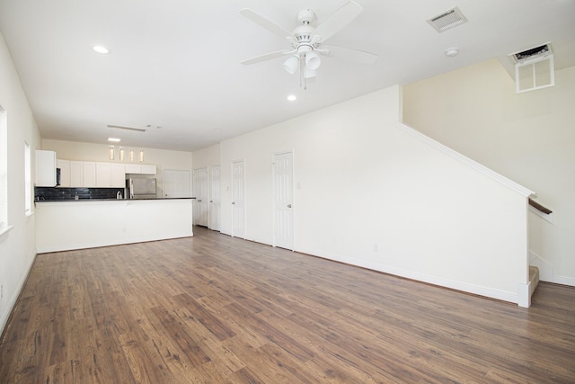 5005 Mallow St A/B, Unit A/B Houston, TX 77033 - unfurnished living room featuring stairs, dark wood-style floors, a ceiling fan, recessed lighting, and baseboards
