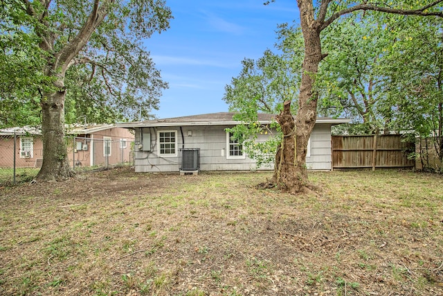 back of property featuring central AC unit