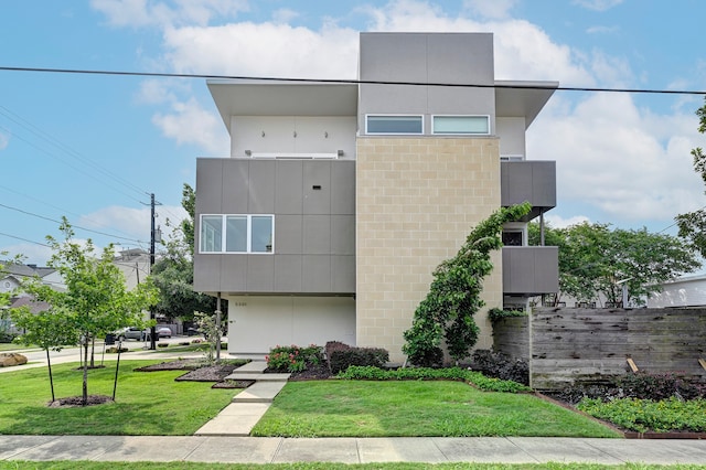 modern home with a front lawn