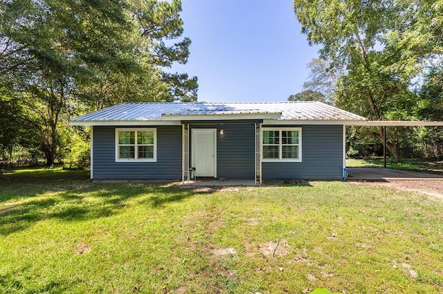 ranch-style home featuring a front yard