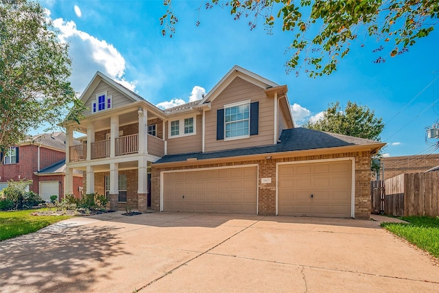 view of front of home with a balcony and a garage