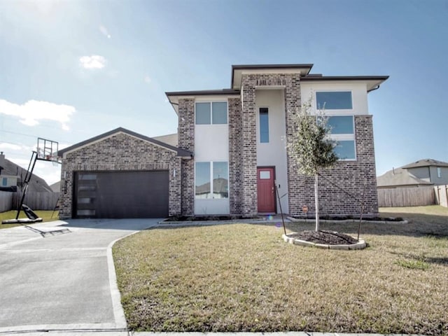 view of front facade featuring a garage and a front yard