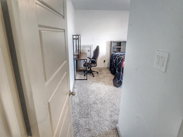 hallway with carpet flooring