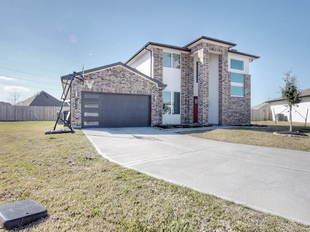 view of front facade featuring a garage and a front yard