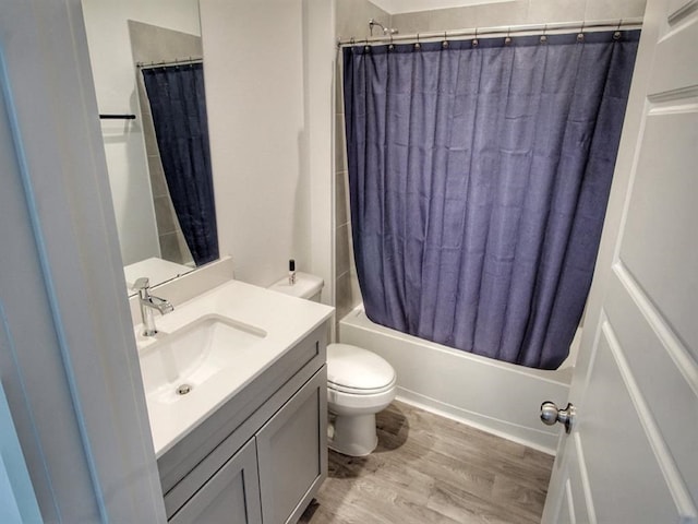 full bathroom with vanity, toilet, wood-type flooring, and shower / bathtub combination with curtain