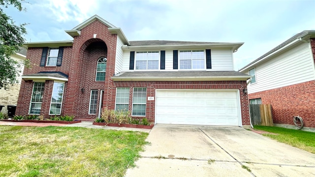 front facade featuring a garage and a front yard