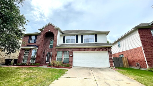 view of front of property with a garage and a front lawn