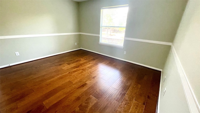 spare room with hardwood / wood-style flooring