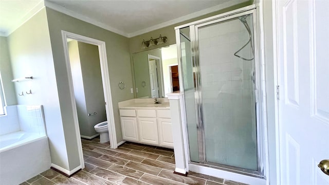 full bathroom featuring crown molding, vanity, toilet, and independent shower and bath