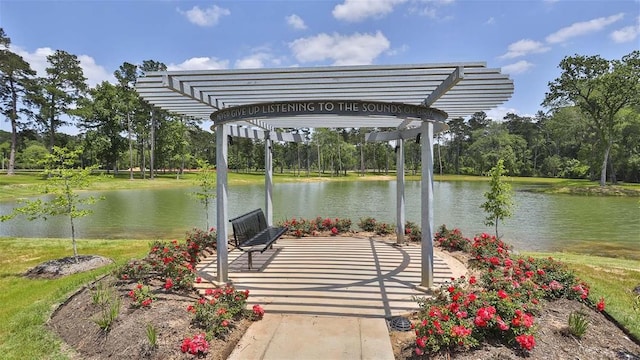 view of patio featuring a pergola and a water view