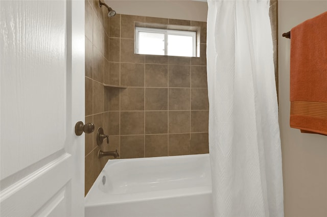 bathroom featuring shower / bath combo with shower curtain