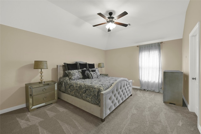 carpeted bedroom featuring ceiling fan and vaulted ceiling