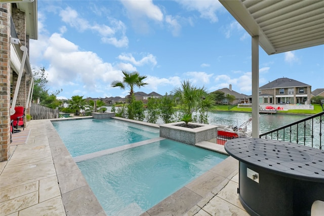 view of swimming pool featuring a water view, a patio, and an in ground hot tub