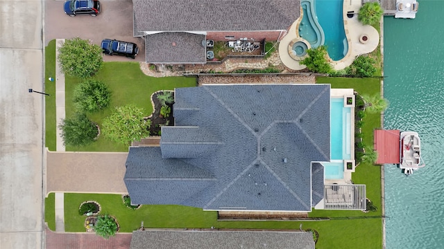 bird's eye view with a water view