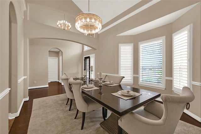 dining room featuring a chandelier and dark hardwood / wood-style floors