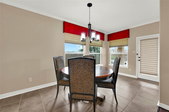 dining room featuring tile patterned floors and an inviting chandelier