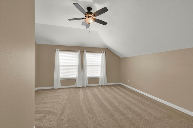 bonus room featuring ceiling fan, lofted ceiling, and light carpet