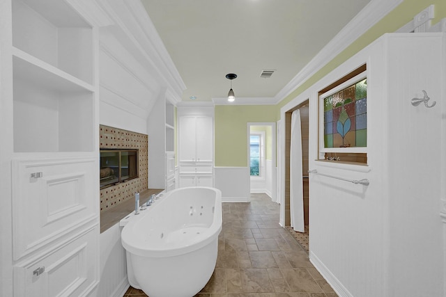 bathroom featuring a bath and ornamental molding